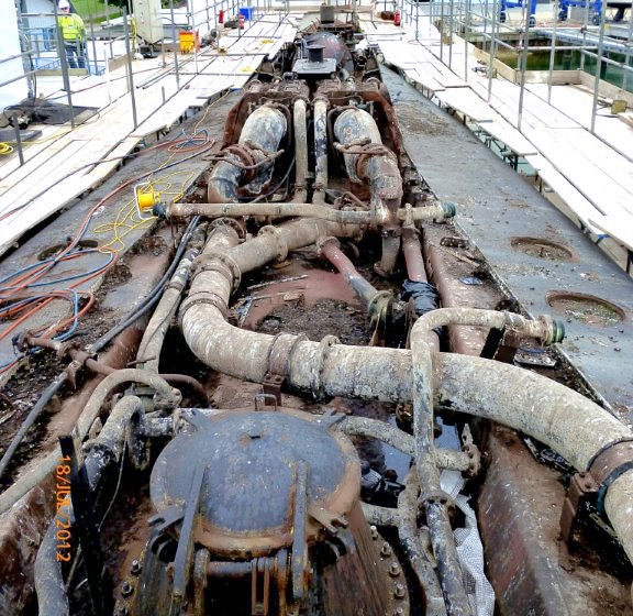 Museum Boat Alliance during repair work. Looking aft showing the exhaust snort pipes as they were after the boat was streamlined. The induction pipe passes into the hull forward, out of sight